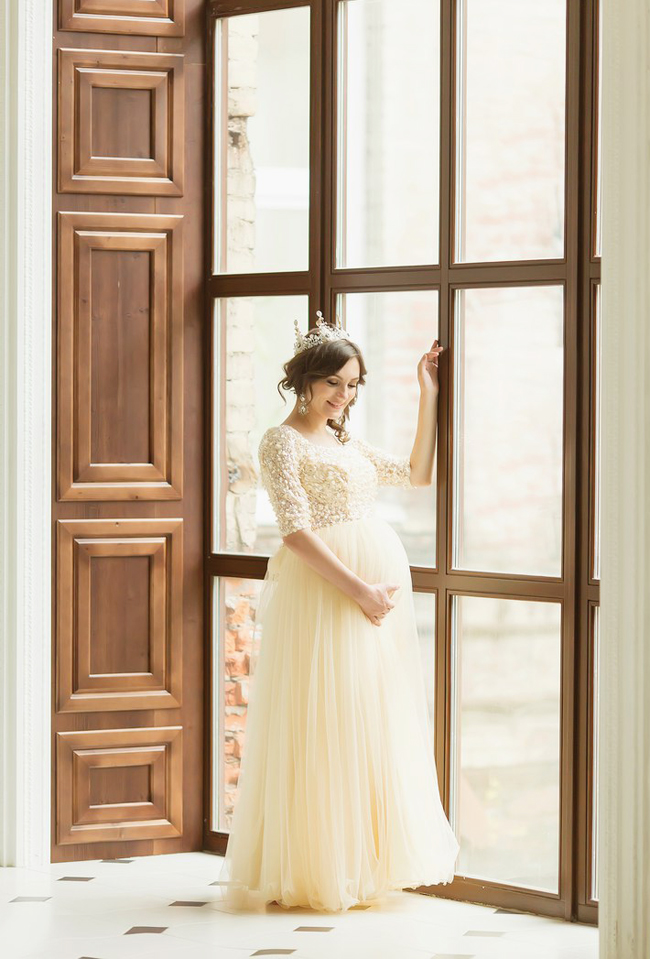 A dreamy romantic maternity photo featuring a beautiful mom-to-be crowned with joy and glory!