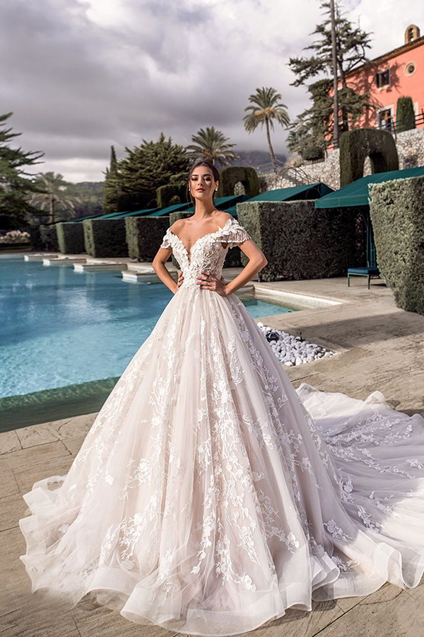 This off-the-shoulder wedding gown from ...
