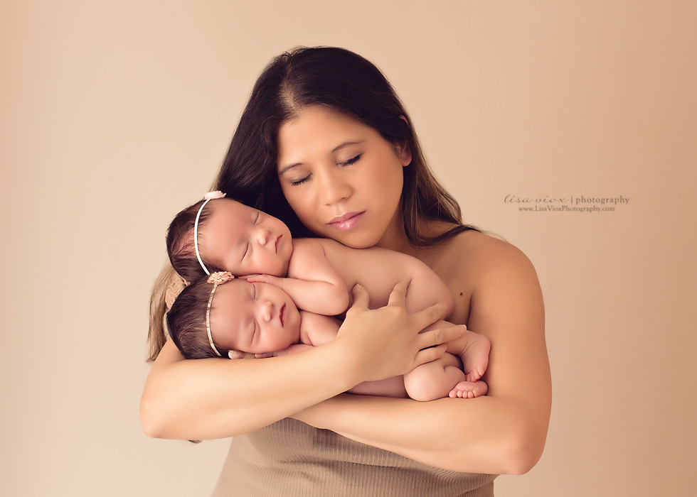 Family is love - beautiful newborn twins with mommy