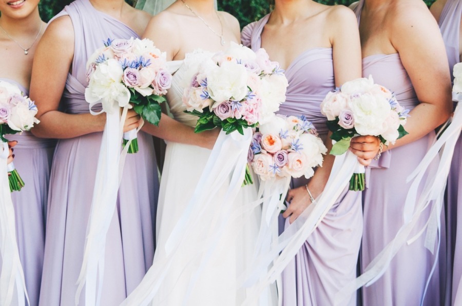 Purple x White bridal party gown and matching bouquet