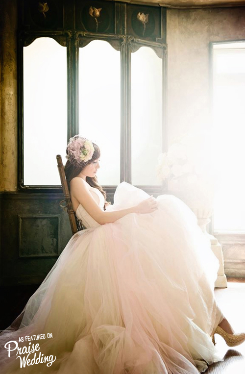 Romantic bridal portrait with light pastel colored gown