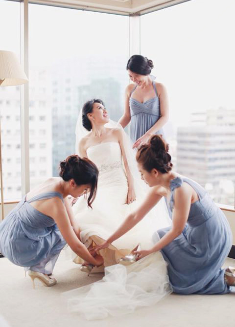 We love how this photo shows the closeness of the bridal party, so simple yet so much sister love!
