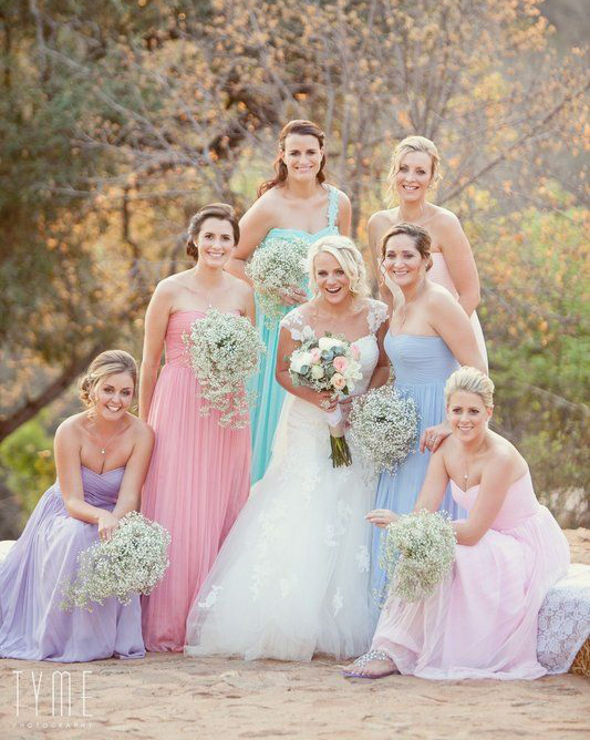 The prettiest pastel bridesmaid dresses with baby's breath bouquets!