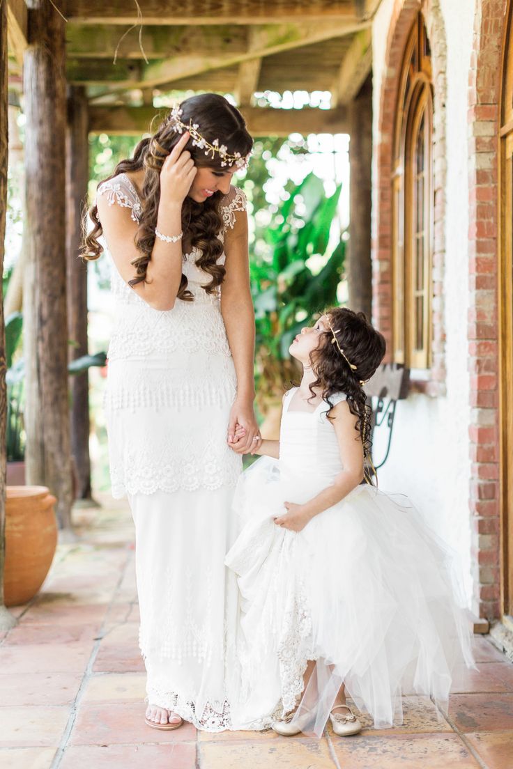 We love this cute idea of dressing up the flower girl just like the bride!