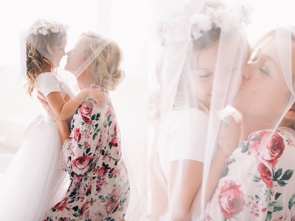 This super adorable Bride & Flower Girl moment is melting our hearts!