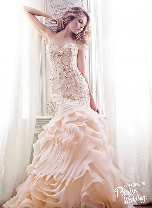 This ruffled mermaid gown by Maggie Sottero is so feminine and charming!