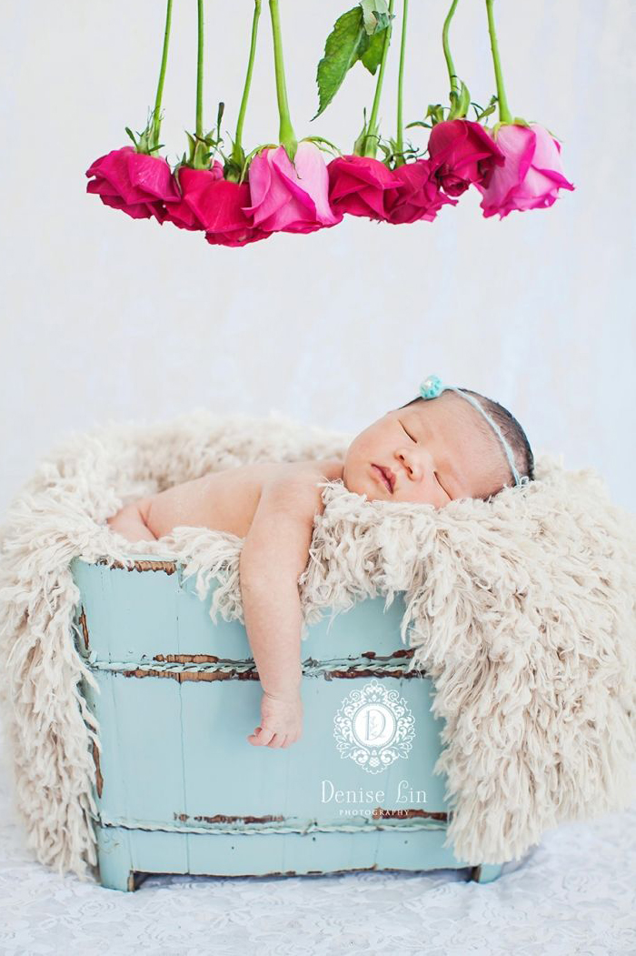 Every child is a gift from heaven above! This newborn photo illustrates love in its purest form!