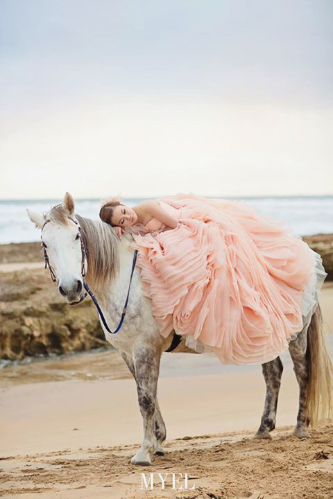 Such a romantic way to show off this Bride's pink ruffled gown!