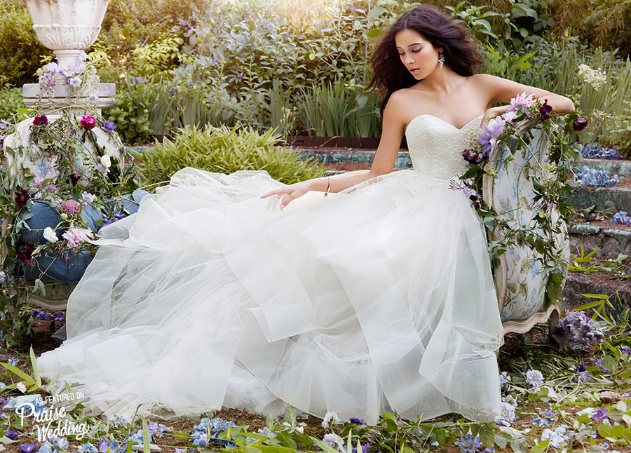 Jim Hjelm bridal gown featuring sweetheart bodice and romantic tiered train!