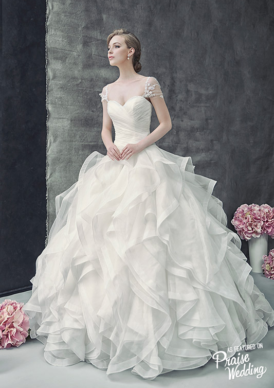 This bridal gown by Divine Couture marries the classic and the new in a perfectly graceful and feminine package!