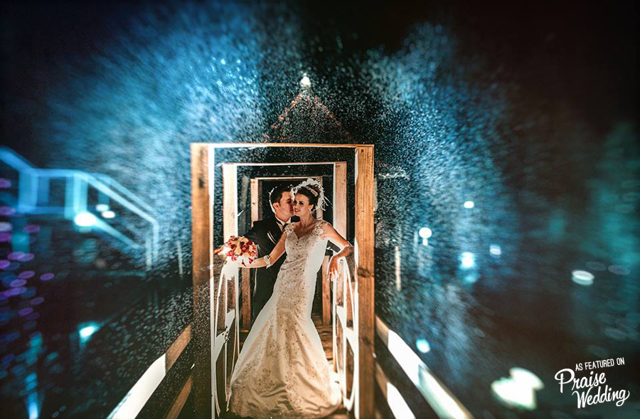 This wedding photo proves that rain or shine, love is on!