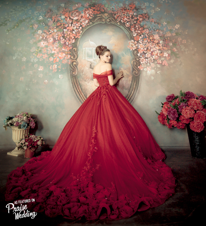 If you’re looking for a gown with a “wow” factor for your big day, this one will do! Stunning off-the-shoulder red gown with a romantic rosy train.