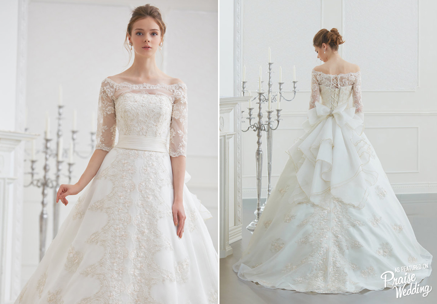 Anna Blanca bridal gown featuring exquisite, hand-crafted golden lace details and a lovely bow tie!