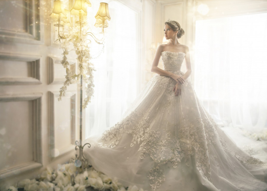 Meticulously detailed lace along with lavish embellishments, this Arale bridal gown is oh so chic!