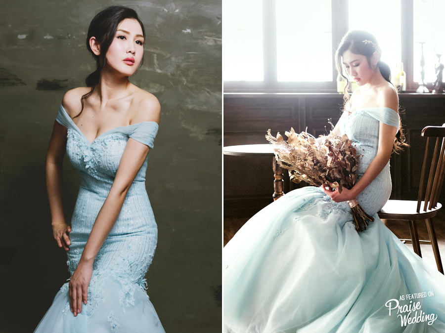 With details that are guaranteed to dazzle , Alba Sposa's baby blue off-the-shoulder mermaid gown is a show stopper!
