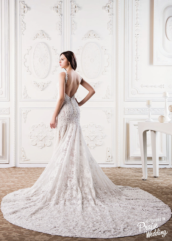 We could never turn down beautiful lace, and this elegant gown from C.H. Wedding is definitely on our dream list!