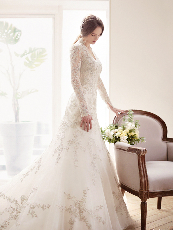 J de Blanc's long sleeved gown featuring beautiful lace details is dreamy sophistication at its best!