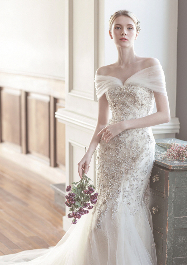 Elegant Jaymi Bride off-shoulder wedding dress featuring beautiful silhouette and equally stunning detailing!