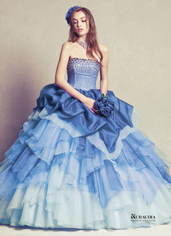 A sparkly blue ball gown from Moussy featuring layers of beauty and details that are guaranteed to dazzle! 