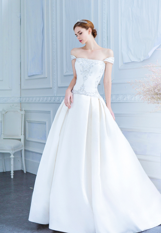 A simple yet beautiful gown from Ray & Co., featuring a sophisticated look with incredibly feminine detailing!