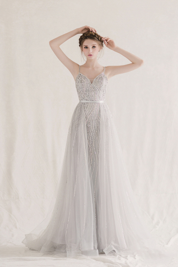 Whimsical, unique, and magical, this glittering silver gown from Bonna & Kimvelo is downright droolworthy!