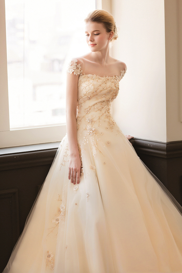 This golden gown from Jaymi Bride features exquisitely embellished details that are guaranteed to dazzle!