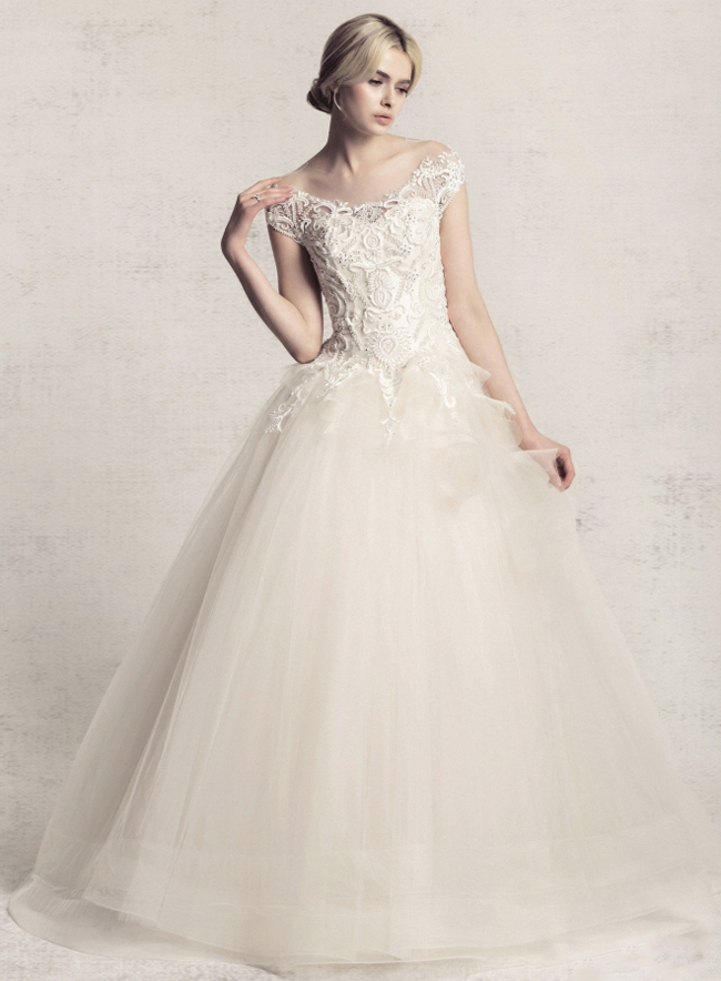 Meticulously detailed combined with airy tulle, this Bride Merci gown is obsession-worthy!