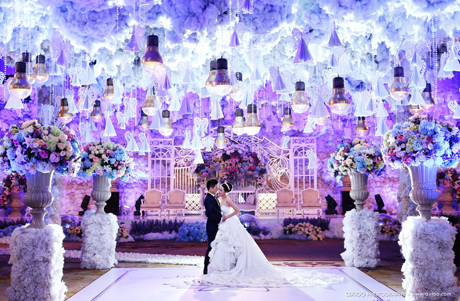 Incredibly beautiful indoor wedding reception with creative magical hanging lights!