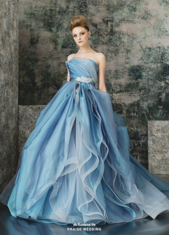 Our jaws are dropping over this stunning ocean blue gown featuring dreamy ruffles and ombre tones!
