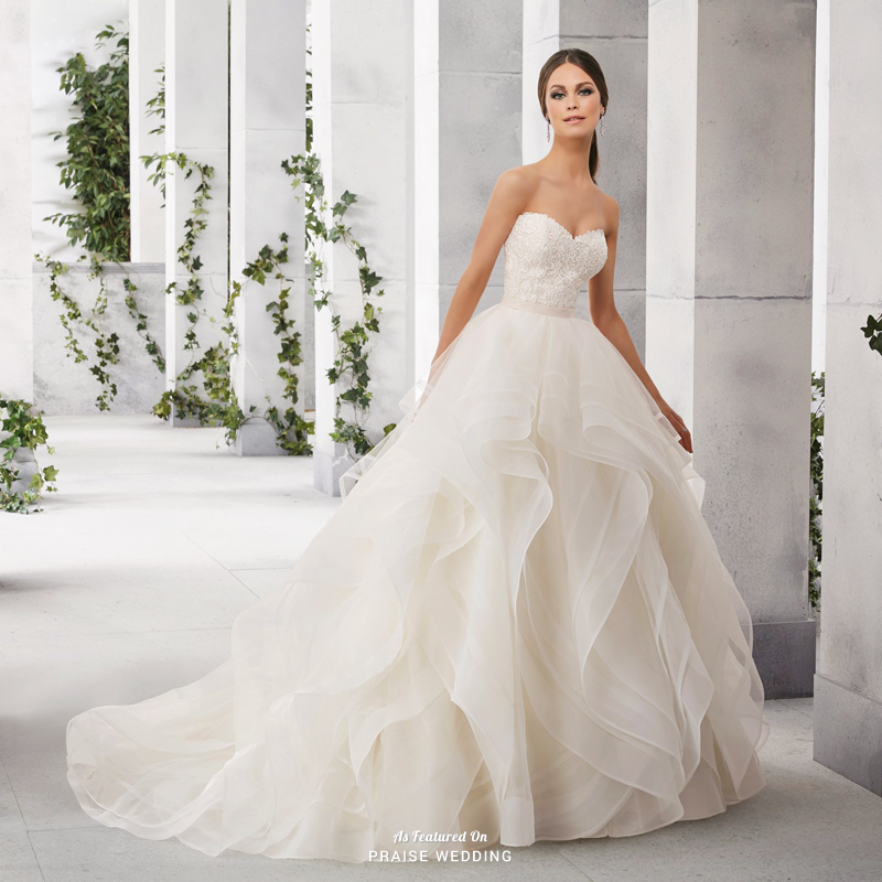 This classic ruffled wedding dress from Madeline Gardner is fit for a princess! 