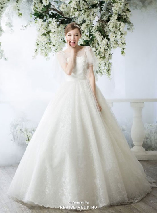 How adorable is this princess-worthy gown from C.H. Wedding featuring dreamy tulle sleeves!