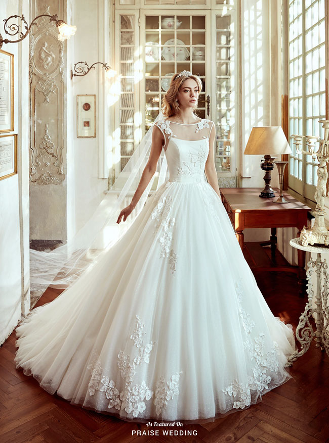 Feminine, elegant and imperial, this wedding dress from Nicole Spose featuring illusion neckline and floral embroideries is incredibly breathtaking!