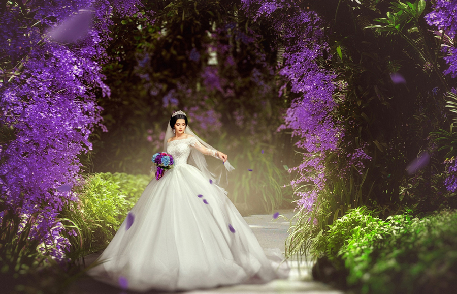 This dreamy bridal portrait filled with purple floral and natural greenery is making us question, "is this real life?!" Too stunning!