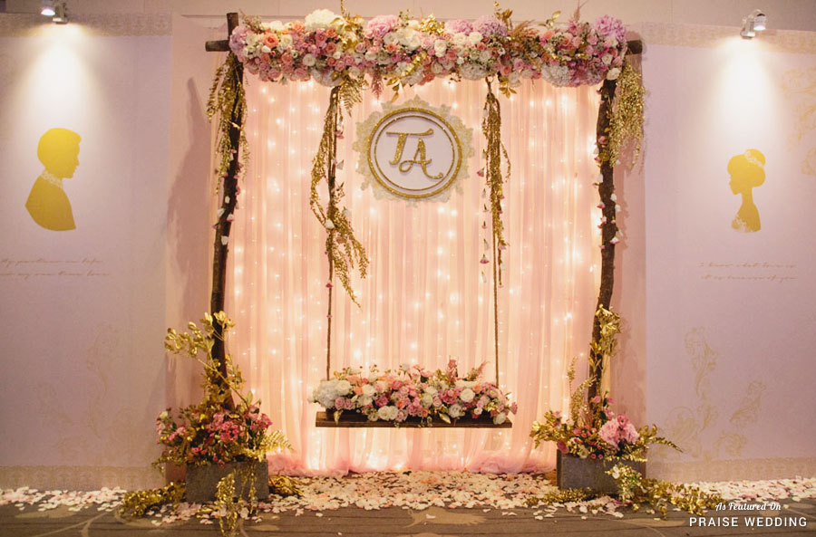 Magical fairytale-inspired wedding décor featuring a romantic swing surrounded by garden flowers!