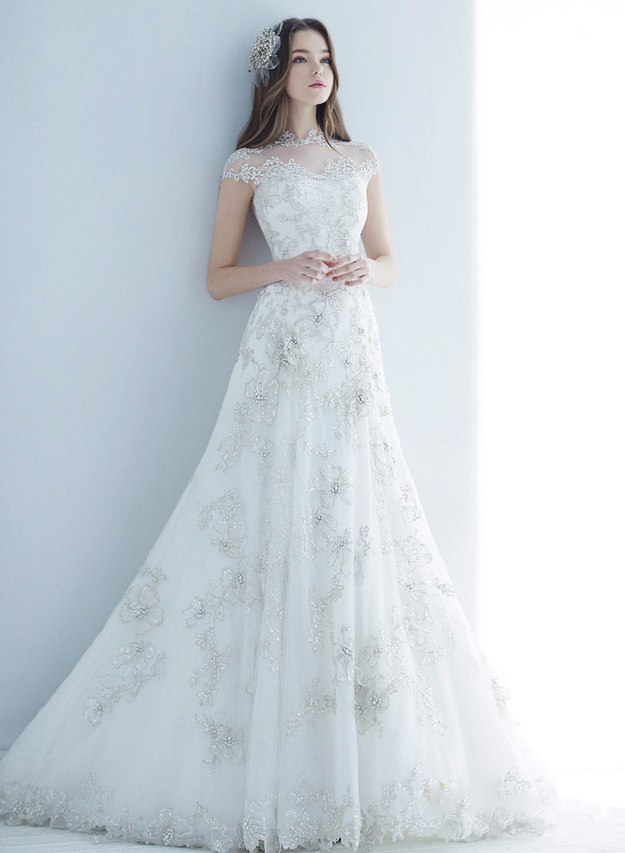 A sophisticated bridal gown from Monica Blanche with incredibly feminine and elegant jeweled detailing!