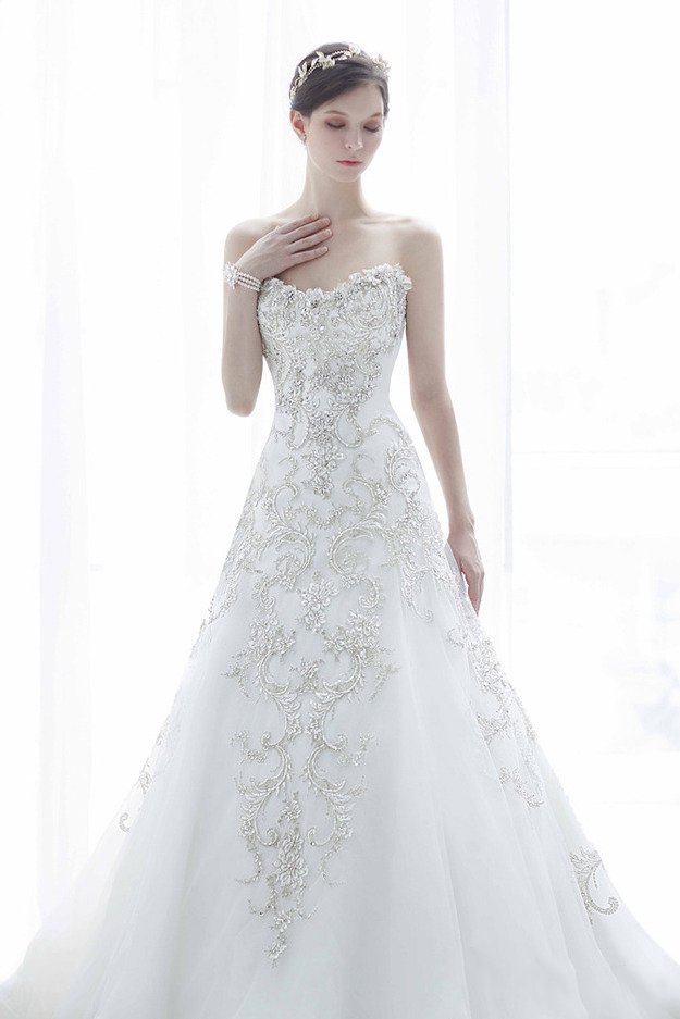 We are officially obsessed with this wedding dress from Monica Blanche featuring beautiful vine-inspired jewel embellishments on a classic chic silhouette