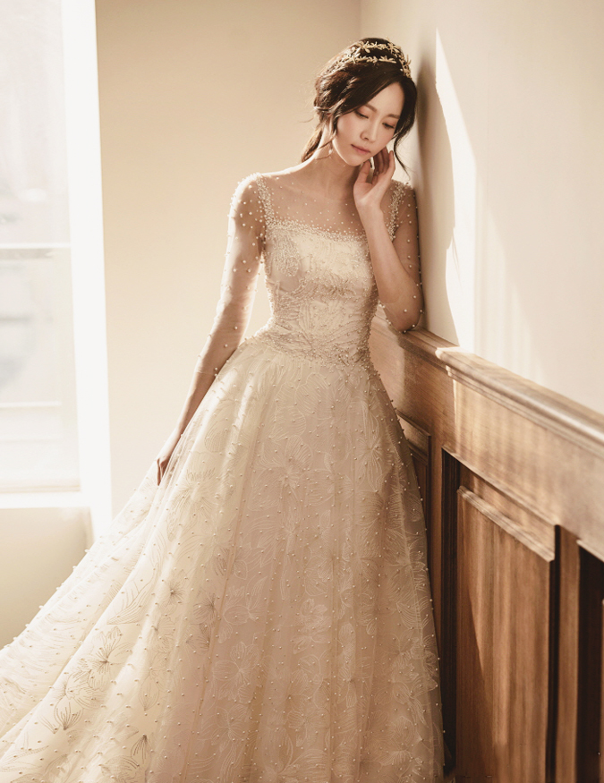 This dreamy ethereal wedding dress from Artesano featuring pearl embellishments is making us swoon!