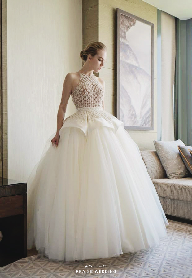 Fashion-forwrad gown from Nicole + Felicia Couture featuring a modern silhouette and lavish detailing!