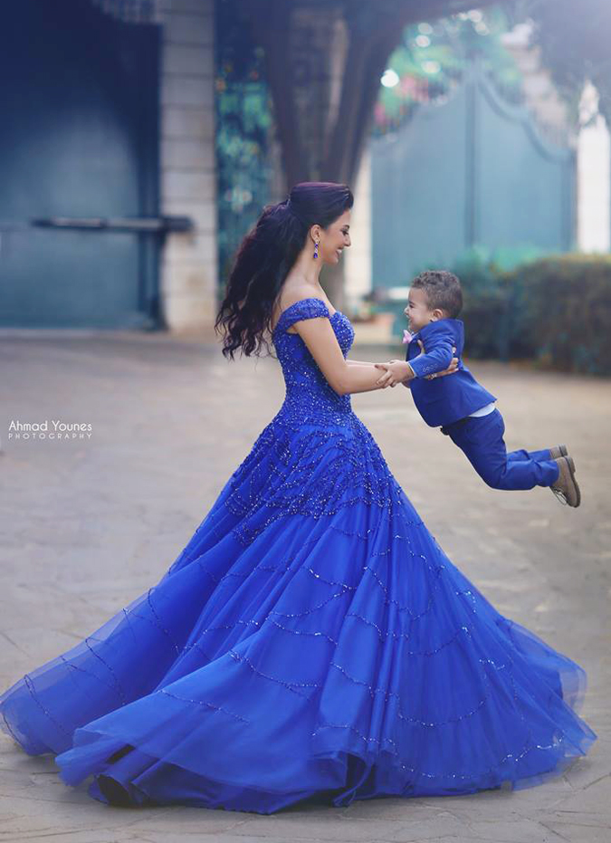 We can't contain ourselves over this cuteness! We love everything about this photo, from the matching royal blue outfits to the contagious pure joy in the air!