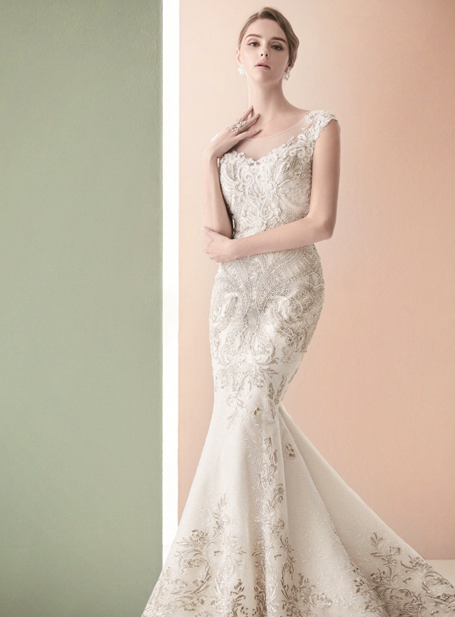This elegant gown from Monetteare features a timeless silhouette infused with metallic thread accents!