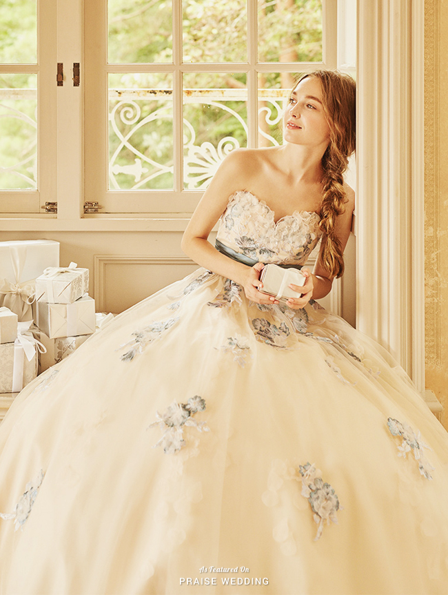 A unique way to show "something blue" with this classic ivory gown from Tutu Dress featuring delicate blue embroideries! 