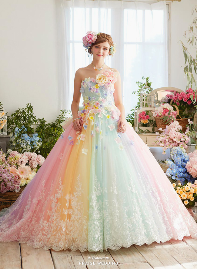 How pretty is this pastel rainbow gown from Nicole Collection featuring 3D floral accents and dreamy lace details?