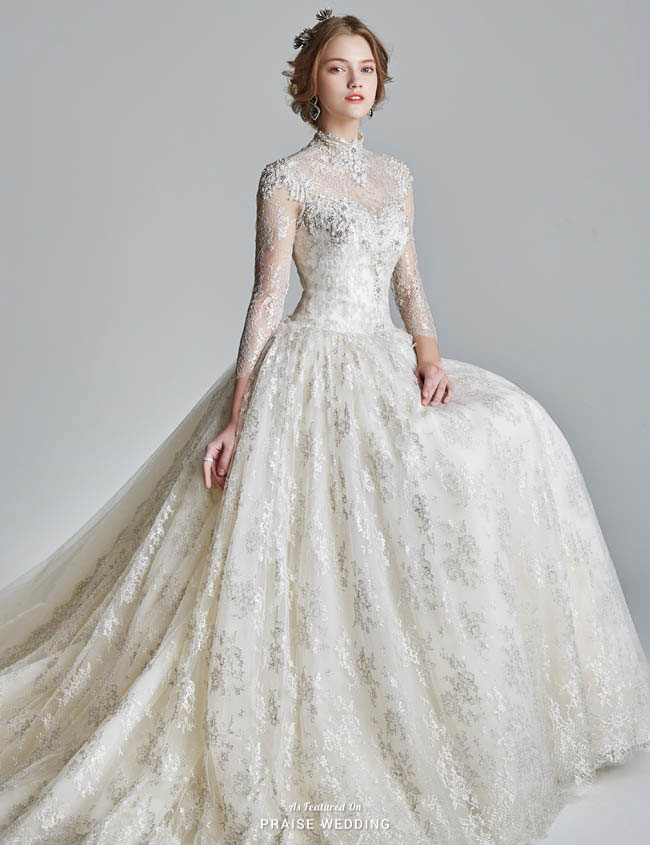 This high-neck wedding dress from Jubilee Bride features a timeless silhouettes with delicate glittering lace details!
