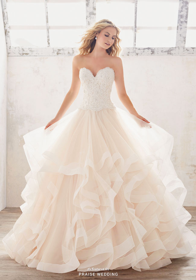 A classic sweetheart wedding dress from Morilee featuring soft and ethereal ruffles!