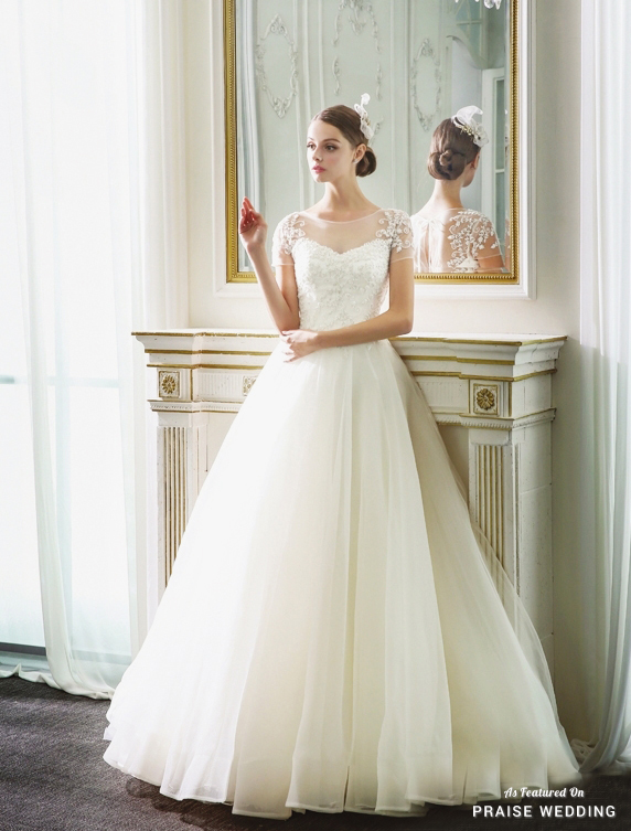 Utterly romantic wedding dress from La Poeme featuring chic embroideried sleeves and an airy tulle skirt! 