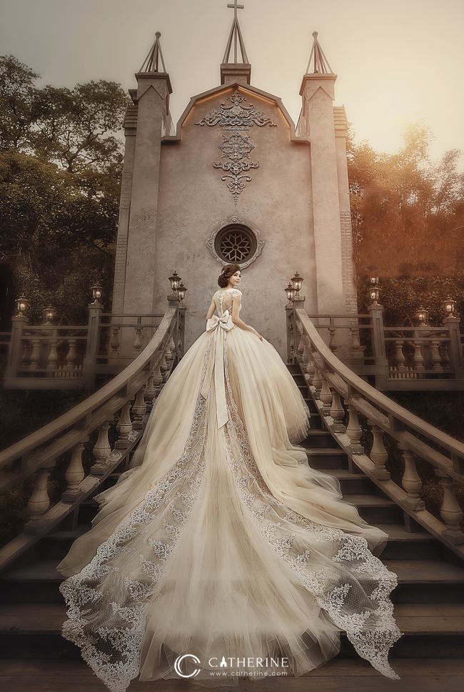 Incredibly breathtaking wedding dress from Catherine Wedding featuring a show-stopping long train with delicate lace accents! 