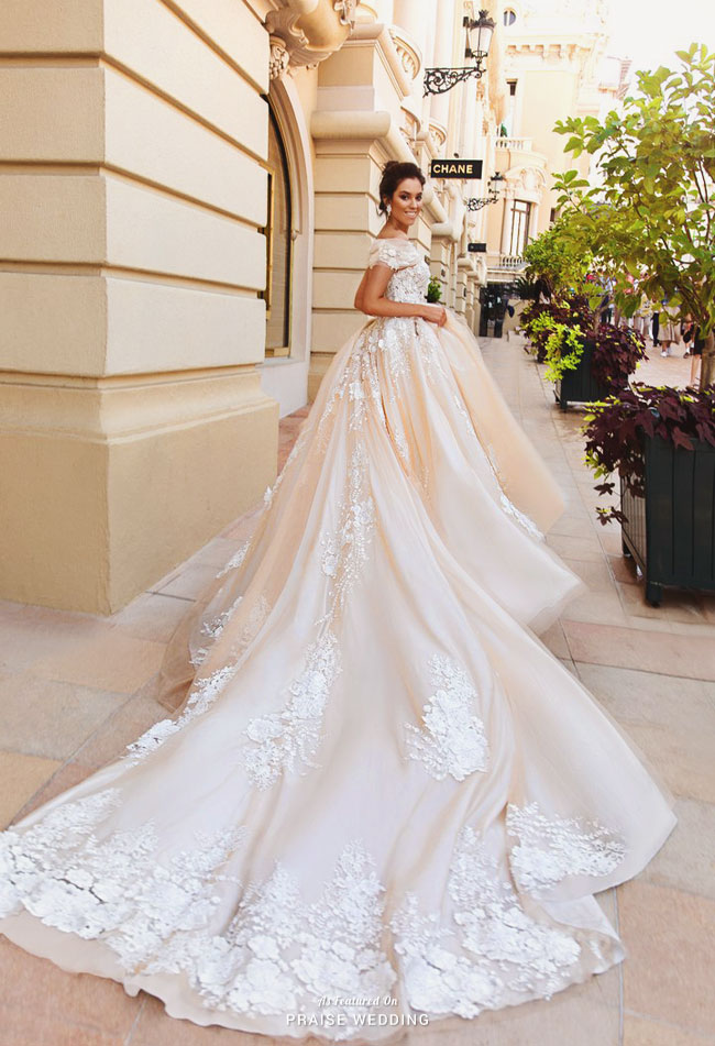 Obsession-worthy peachy blush gown from Crystal Design featuring 3D floral accents and exquisite detailing! 