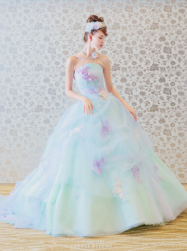 Lovely pastel blue gown from The Lovel featuring chic floral embellishments and a dreamy silhouette.