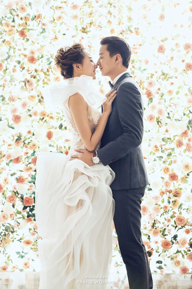 Utterly romantic rose garden-inspired prewedding portrait featuring a dreamy ruffled gown.