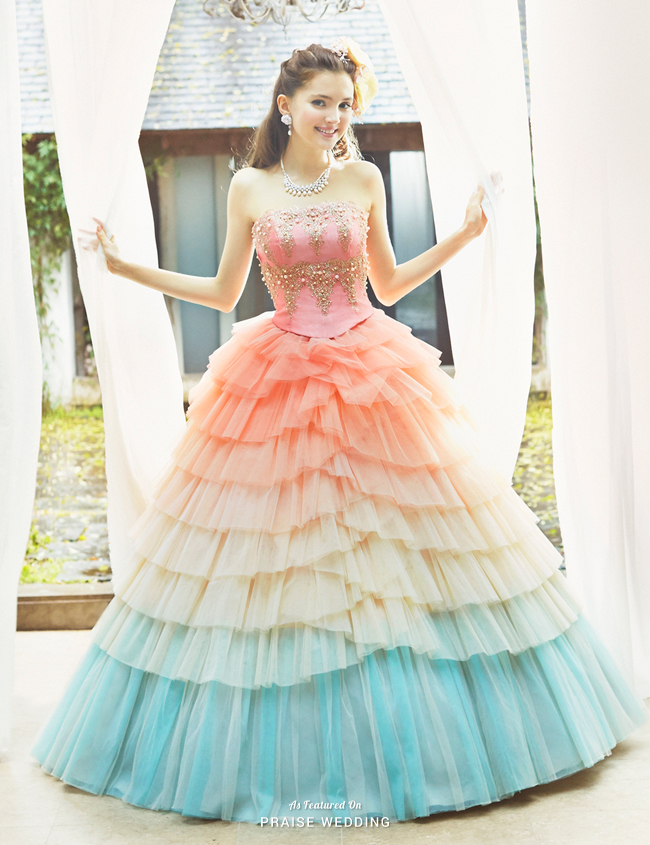 For the romantic bride at heart, nothing is sweeter than twirling in this pastel rainbow ball gown from Joyful Eli!